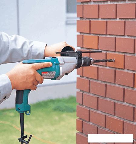 Ударная дрель Makita HP 2051